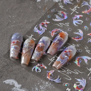 Iridescent koi fish nail art stickers with Chinese calligraphy and colorful gradients