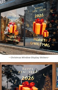 Close-up of golden 2026 Christmas gift box window stickers for holiday shop decoration