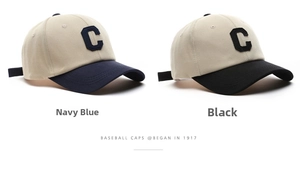 Detail showing two-tone cotton baseball caps with C letter patch and adjustable straps