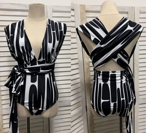 Detail of black and white geometric pattern and cross back tie-up straps on monokini