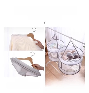 Comparison showing flat mesh drying basket preventing sweater deformation versus hangers
