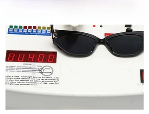 Cat eye sunglasses detail showing UV400 protection test on professional digital equipment