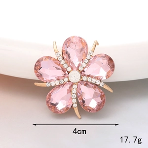 Macro shot of 4cm pink rhinestone flower accessory with gold border and 17.7g weight