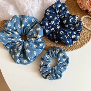 Denim fabric floral embroidery scrunchies in light and dark blue tones for women
