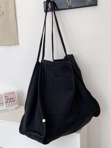 Large black canvas tote bag for women with long shoulder straps for daily commuting