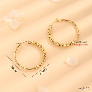 Golden titanium steel hoop earrings with bead detailing in 38mm minimalist design