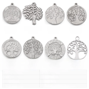 Detailed grid of stainless steel Tree of Life pendants in various embossed and cutout styles