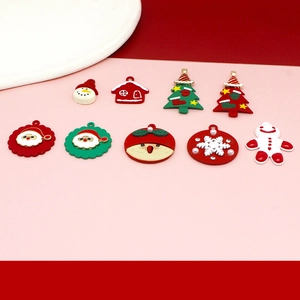 Flat lay of Christmas charms including snowman and gingerbread man for DIY jewelry