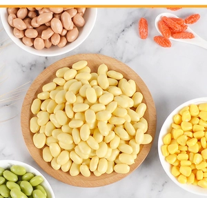 Detailed macro shot of realistic PVC soybean models displayed on a light wooden plate