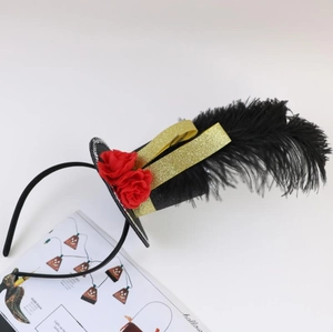 Macro shot of Halloween headband with black glitter top hat, red roses and feather detail