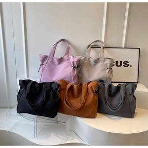 Large nylon tote bags in multiple colors with drawstring sides and twin top handles