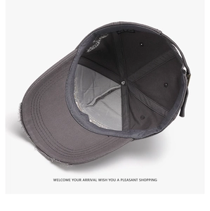 Detail of 100% cotton inner lining with sweatband and wash label of distressed baseball cap