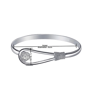 Detail showing 6cm inner diameter of silver rose bangle with woven metal texture