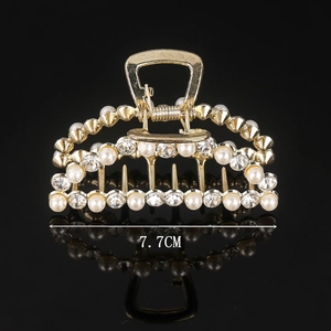 Elegant 7.7cm gold alloy hair claw clip with faux pearls and rhinestones on black background