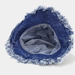 Vintage dark blue denim bucket hat featuring stylish frayed edges and a wide brim design