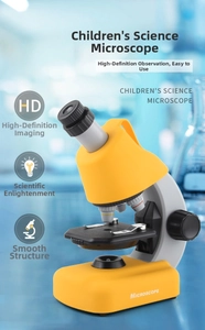 Close-up of portable children microscope for biological science experiments in yellow