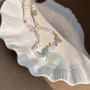 Starfish and pearl beaded necklace with sea shell pendants in white display tray