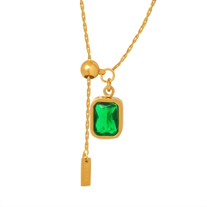 Elegant gold necklace with rectangular emerald zircon pendant on white background