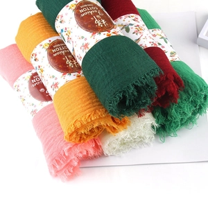 Solid color pleated cotton linen scarf with frayed edges in various vibrant colors