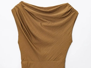 Detail of a brown sleeveless top featuring a chic cowl neck and textured fabric