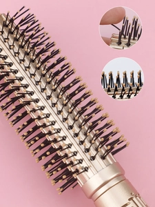 Close-up of flexible black bristles with anti-static tips on a professional round hairbrush