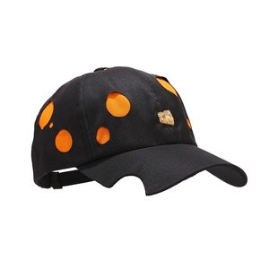 Black cutout baseball cap with orange round holes and distinctive notched brim design