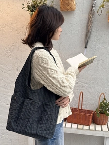 Large plaid canvas tote bag for women featuring side pockets and casual slouchy style