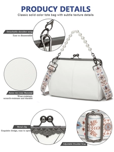 Detail view of white tote with pearl handle, floral strap, and metal clip closure