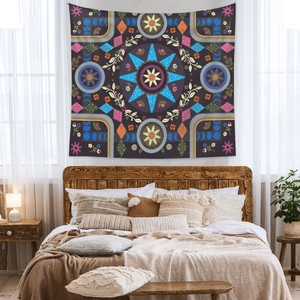 Mandala tapestry with bohemian patterns hanging over a bed in a cozy bedroom setting