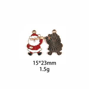 Detail view of 15x23mm enamel Santa Claus alloy pendant with front and back metal texture