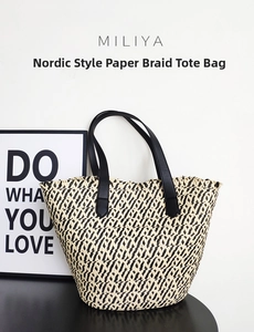 Detail of black and white woven paper straw pattern on a large minimalist tote bag
