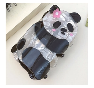 Close-up of panda hair claw clip in pearlescent acetate with a pink floral detail