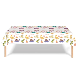 Detail of disposable dinosaur party tablecloth featuring cartoon animals and cakes
