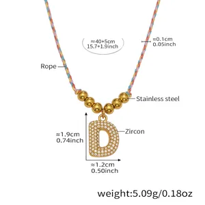 Detail view of letter D zircon pendant on colorful rope chain with size dimensions