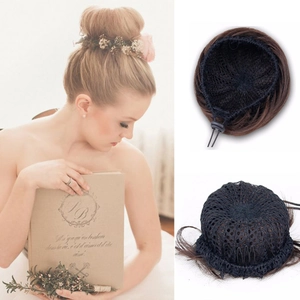 Detail of dark brown hair bun piece with internal drawstring, mesh net and steel clips