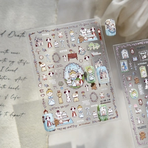 Macro detail of 3D embossed nail stickers featuring vintage fairy tale and puppy designs