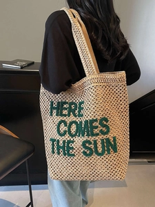 Large woven straw tote bag with Here Comes The Sun embroidery for beach vacations