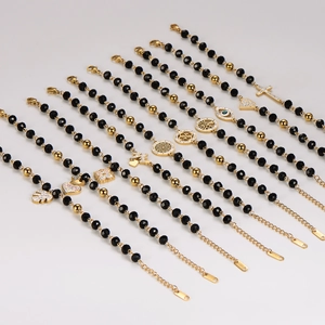 Black beaded stainless steel bracelets with gold charms like tree of life and heart
