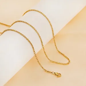 18K gold plated stainless steel pearl chain necklace with lobster clasp on a white stand