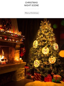 Detail of warm LED Christmas hanging lights with Santa motifs in a cozy fireplace setting