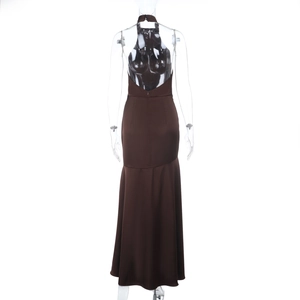 Detail showing the elegant backless halter neck and satin texture of the brown evening gown