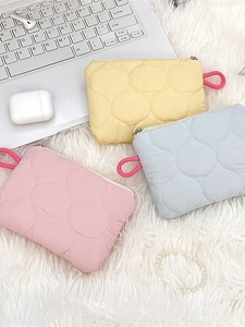 Quilted nylon organizer pouch set in cream, blue, and pink for cosmetics and small items