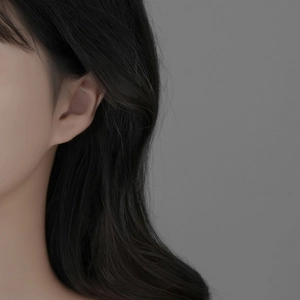 Elegant S999 sterling silver lava butterfly stud earrings worn by a model in a minimal style