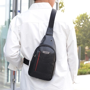 Men's waterproof black PU leather crossbody chest bag with headphone port and red zipper detail