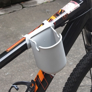 Grey silicone stroller cup holder mounted on a bicycle frame for bottle storage