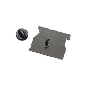 Detailed back view of enamel pin showing black metal base and rubber clutch closure