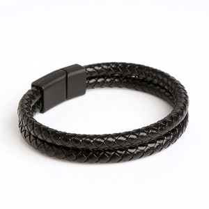Close-up of black double-layered braided leather bracelet with matte magnetic clasp