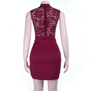 Detail view of the lace patchwork and slim fit design on the back of the burgundy dress
