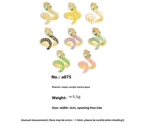 Macro detail of 18k gold plated snake rings featuring colorful enamel and zircon stones