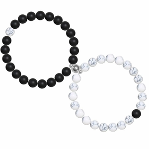 Macro shot of magnetic couples bracelets with matte black and white marble stone beads